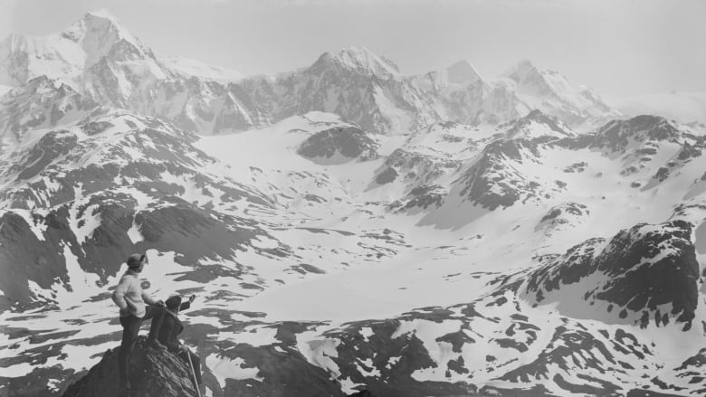 181031155800-from-a-peak-on-south-georgia-island-frank-worsley-and-an-expedition-member-peer-down-on-the-endurance.jpg